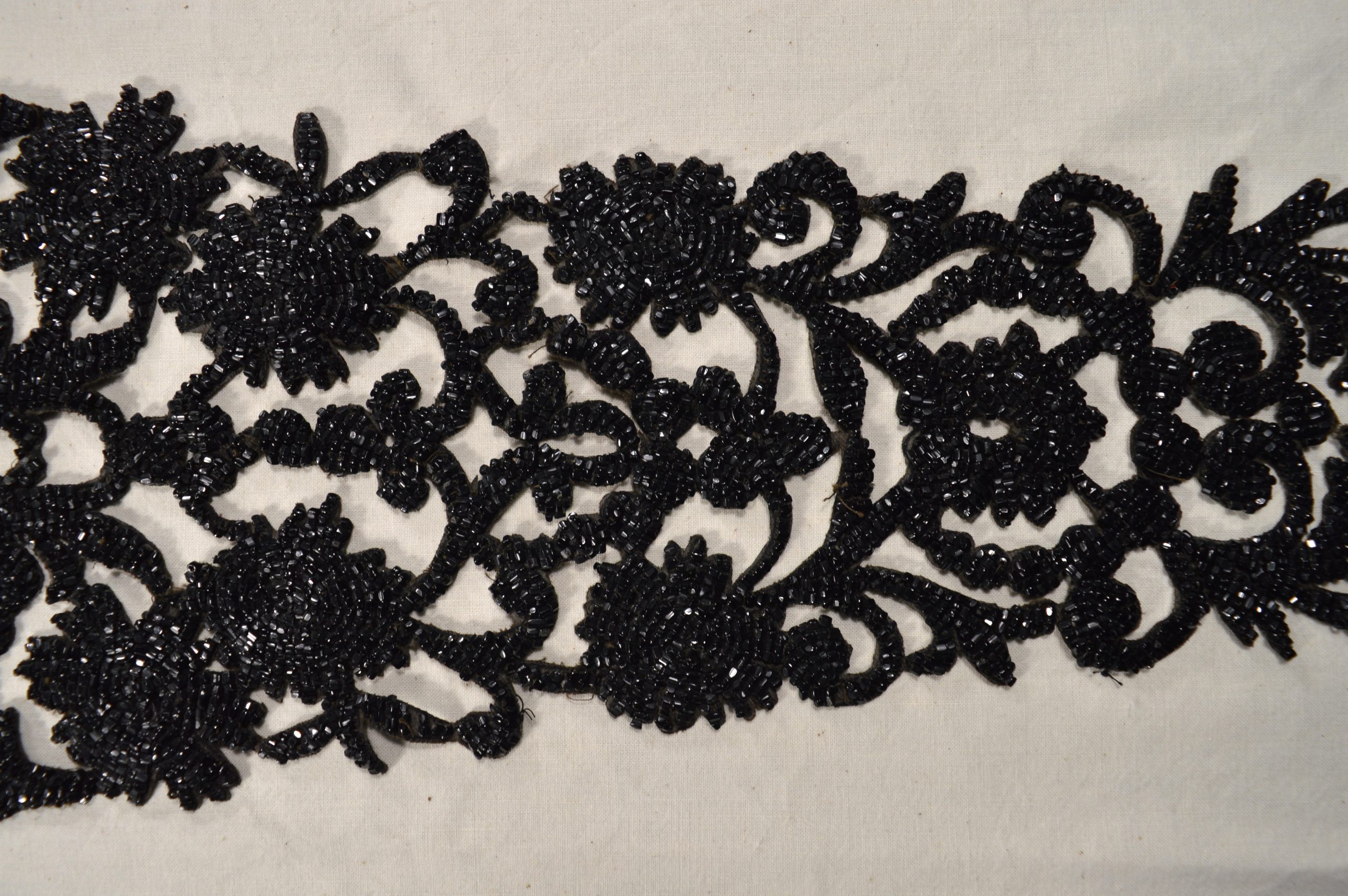 DOC_961g_002 Detail of Victorian floral passementerie made from jet beads on stiffened linen